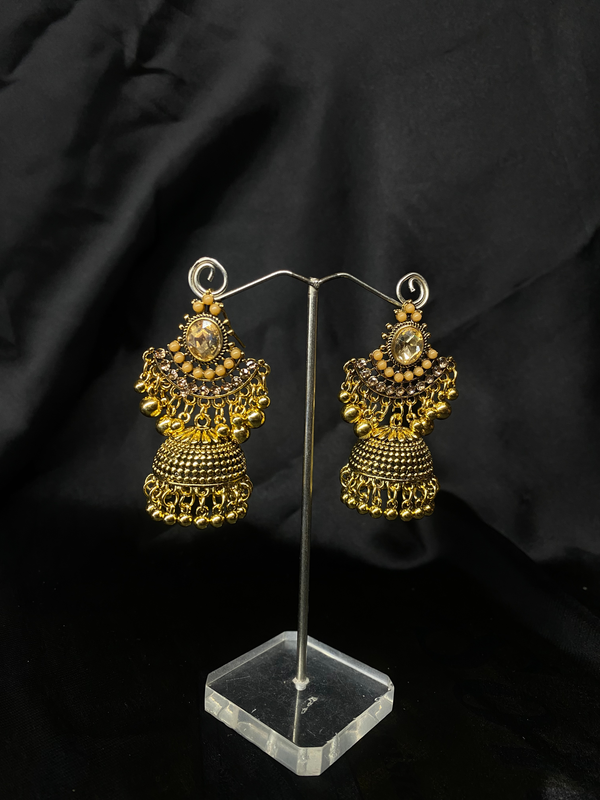 Oxidized Golden Jhumka Earrings With Golden Stones.