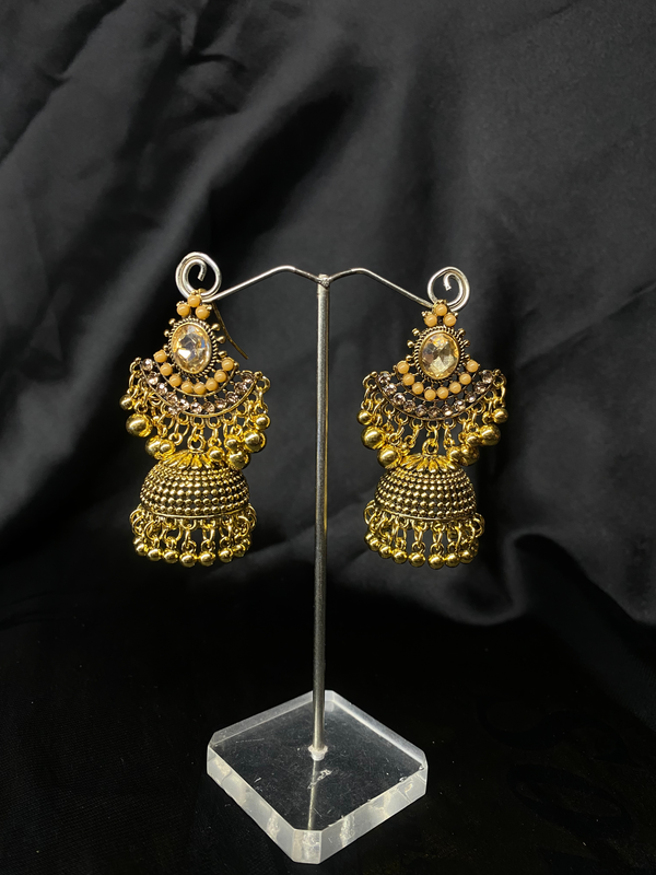 Oxidized Golden Jhumka Earrings With Golden Stones.