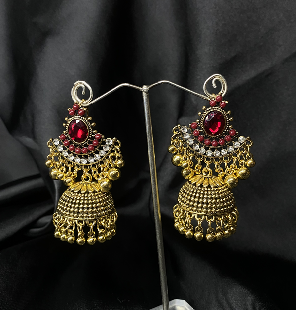 Oxidized Golden Jhumka Earrings With Re Stones.