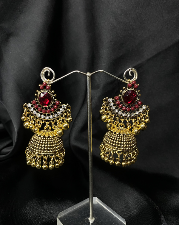 Oxidized Golden Jhumka Earrings With Re Stones.