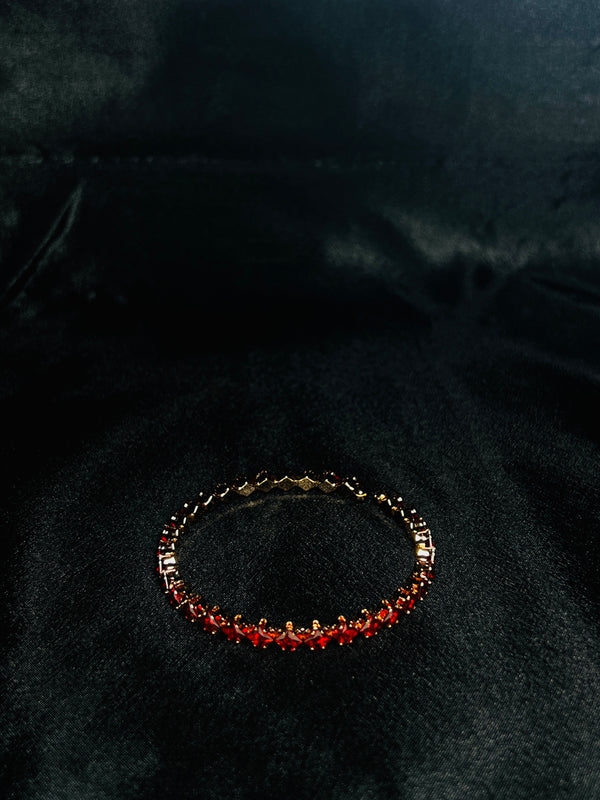 Gold-Toned Tennis Bracelet With Red Stones