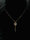 Elegant Gold-Tone Floral Pendant Necklace with Crystal Detailing
