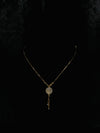 Elegant Gold-Tone Floral Pendant Necklace with Crystal Detailing